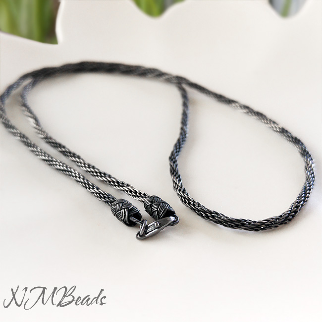 Hand braided twisted chain is made from fine silver wire.